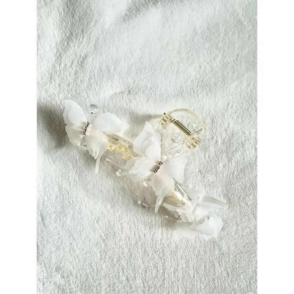Flutter butterfly off-white hair claw with rhinestone detail 